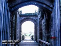 Portchester Castle Barbican - previous guards seen crossing the drawbridge