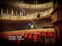 Who sits at the back of the auditorium of the 1856 theatre?